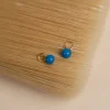 AURA MARINE BLUE GOLDEN EARRING CHARM