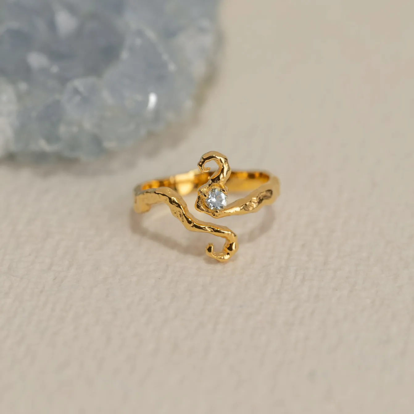 AURELIA BLUE TOPAZ GOLDEN RING