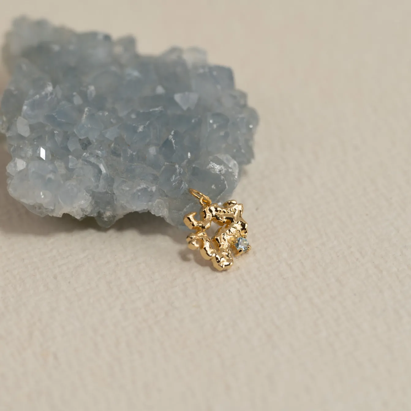 AURELIA BLUE TOPAZ GOLDEN PENDANT