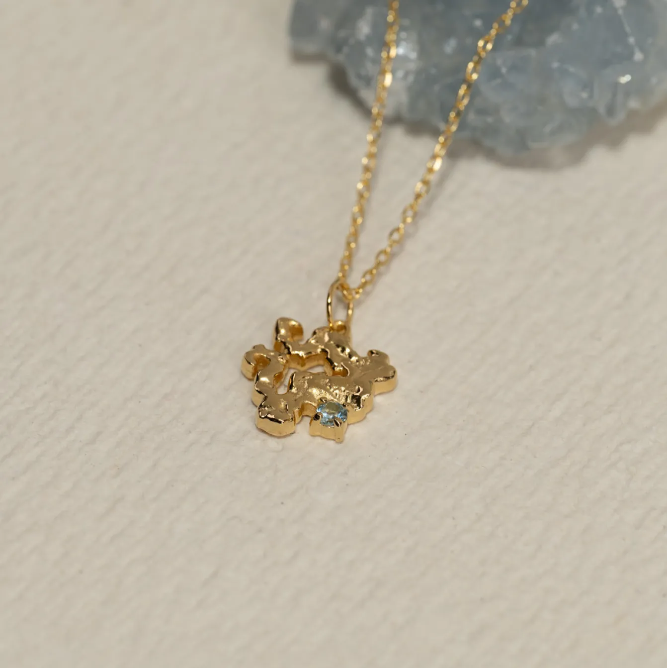 AURELIA BLUE TOPAZ GOLDEN PENDANT