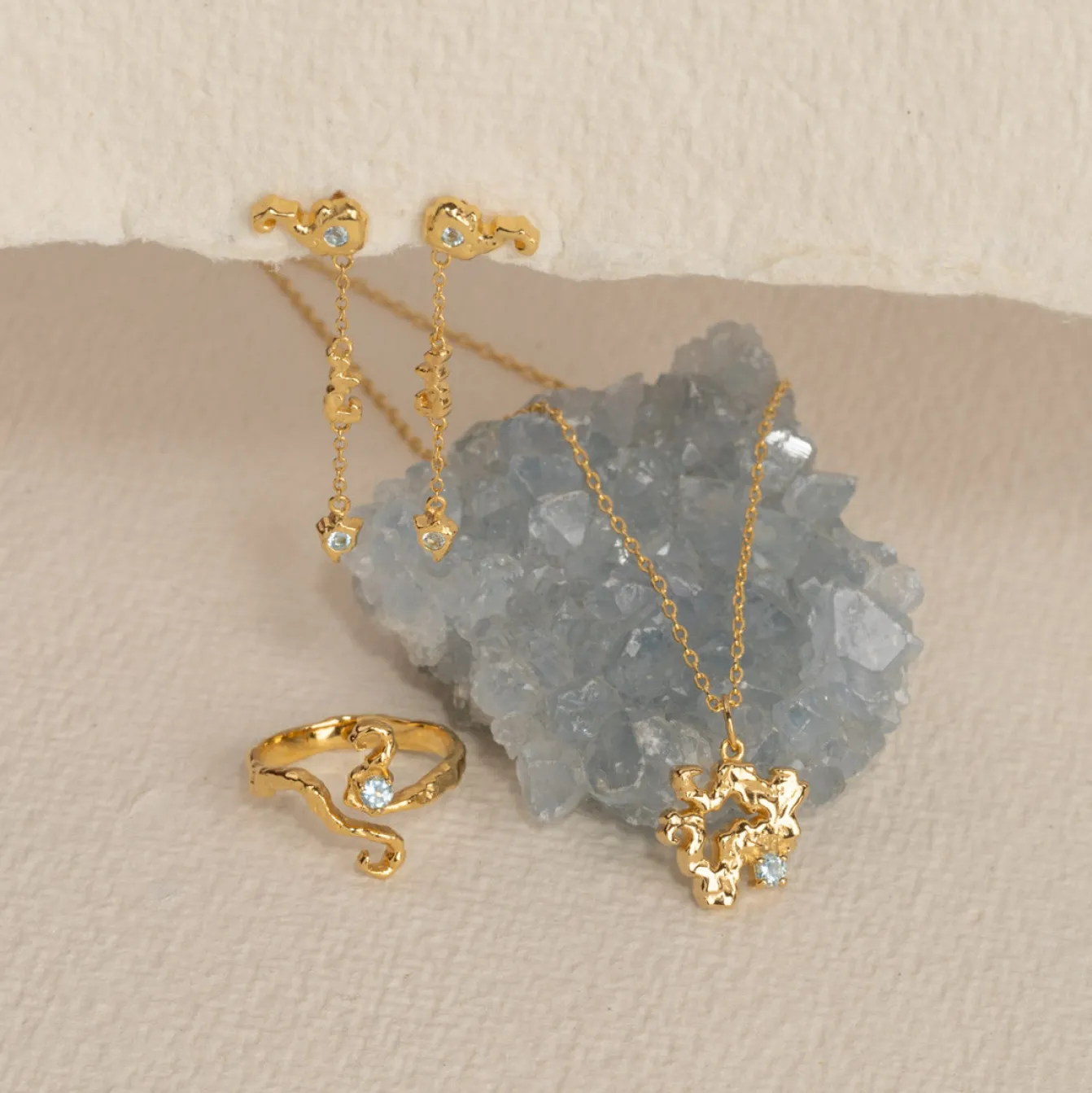 AURELIA BLUE TOPAZ GOLDEN RING