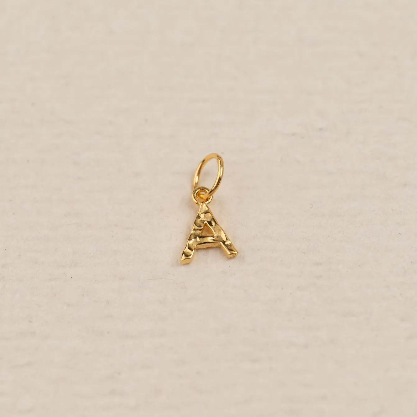 LETTER MOLTEN GOLDEN PENDANT