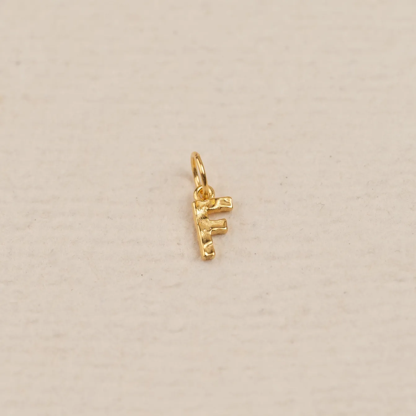 LETTER MOLTEN GOLDEN PENDANT