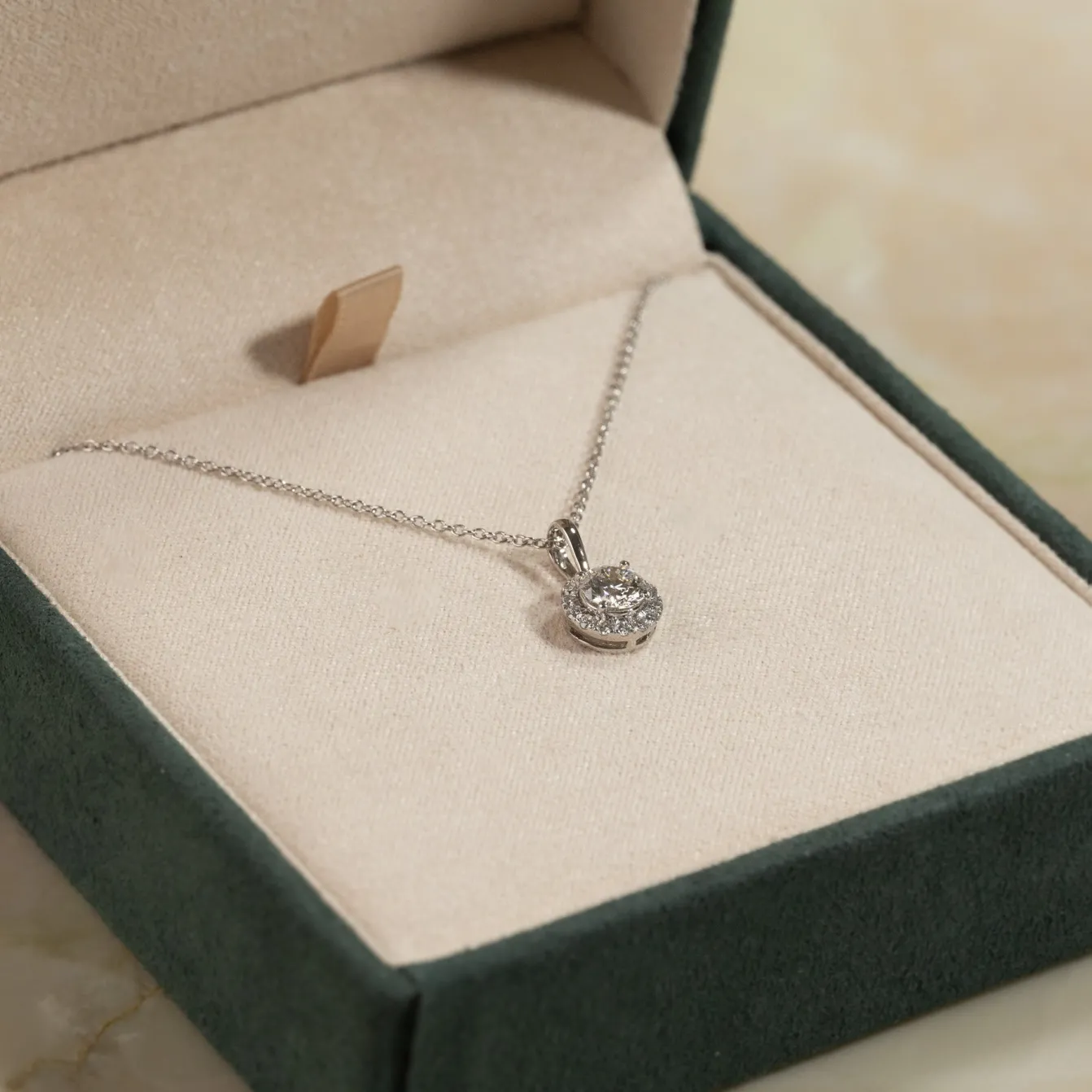 ROUND HALO DIAMOND PENDANT - 0.66ct - WG