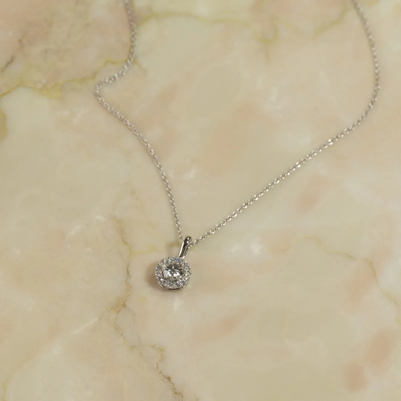 ROUND HALO DIAMOND PENDANT - 0.66ct - WG