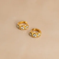 SELENE BLUE TOPAZ GOLDEN HUGGIE EARRING