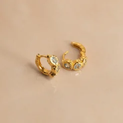 SELENE BLUE TOPAZ GOLDEN HUGGIE EARRING