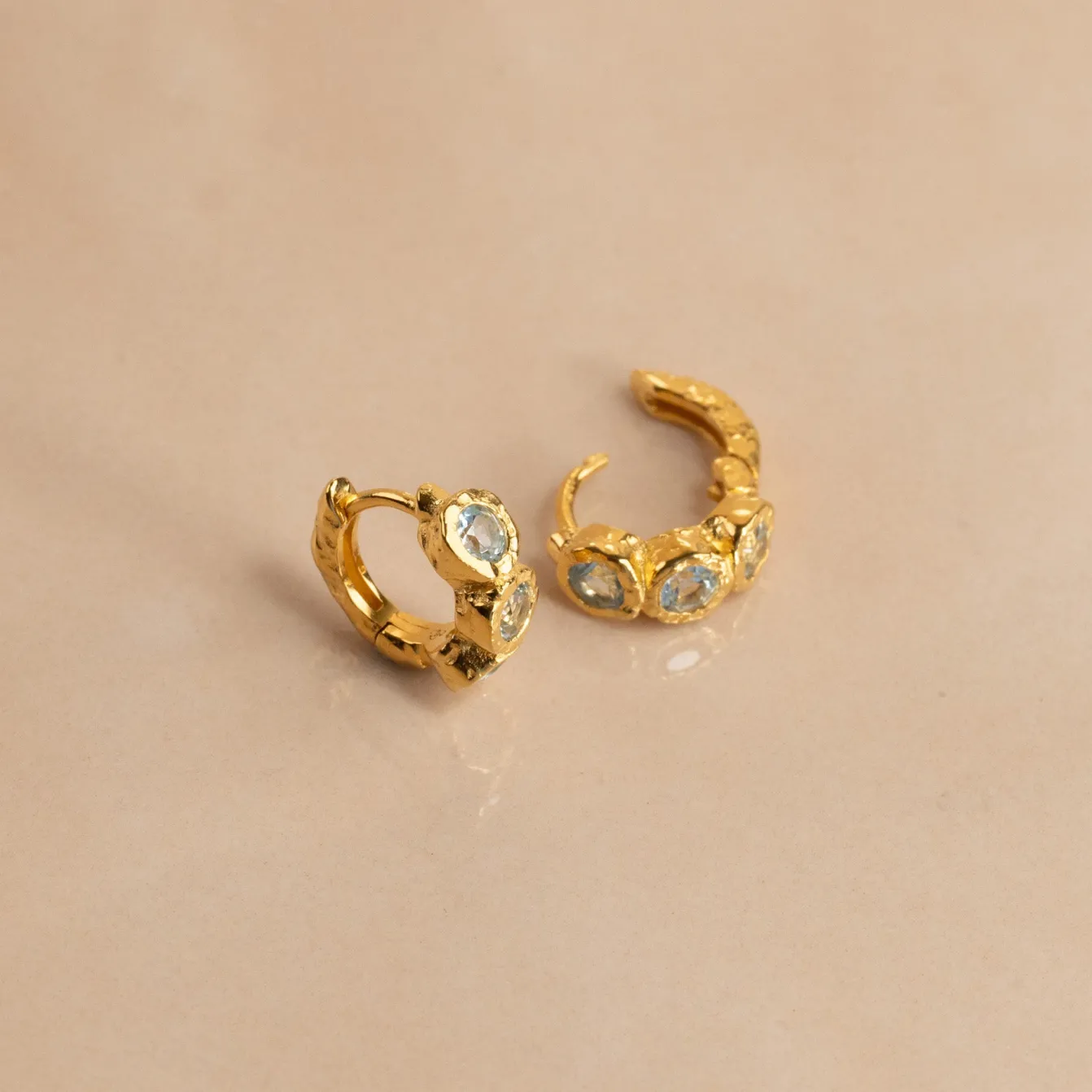 SELENE BLUE TOPAZ GOLDEN HUGGIE EARRING