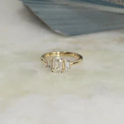 THREE-STONE EMERALD-CUT DIAMOND RING - 1.5ct - YG