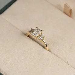 THREE-STONE EMERALD-CUT DIAMOND RING - 1.5ct - YG