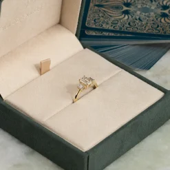 THREE-STONE EMERALD-CUT DIAMOND RING - 1.5ct - YG